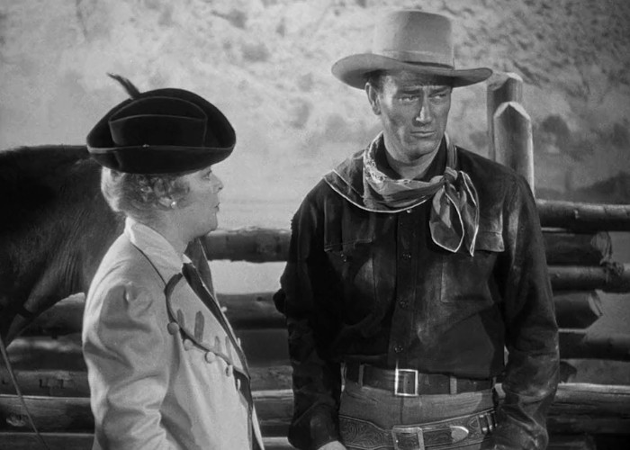 John Wayne and Marjorie Rambeau in In Old Oklahoma (1943)